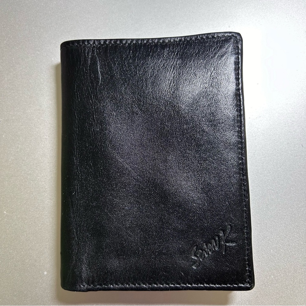 Black bifold leather wallet by Swank 5” x 3-3/4” x 5/8”